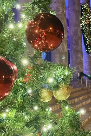 A Christmas tree decorated outside of the Sidney and Berne Davis Art Center