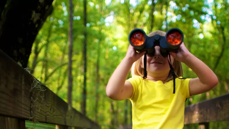 Child with binoculars